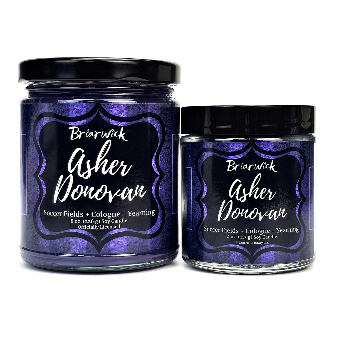 Asher Donovan 8oz & 4oz eggplant candles with purple striped designs on a white background