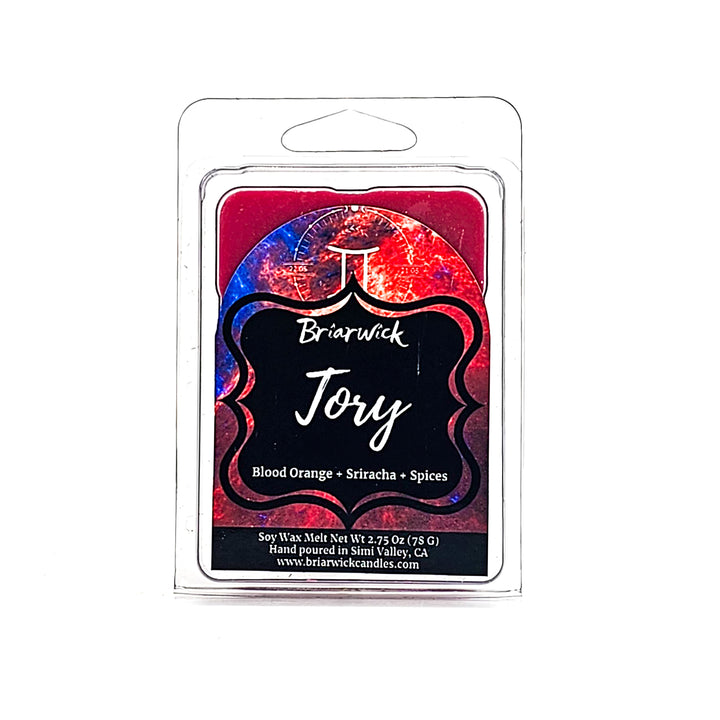 Tory 2oz cherry red Wax Melt with blue galaxy gemini design on a white background