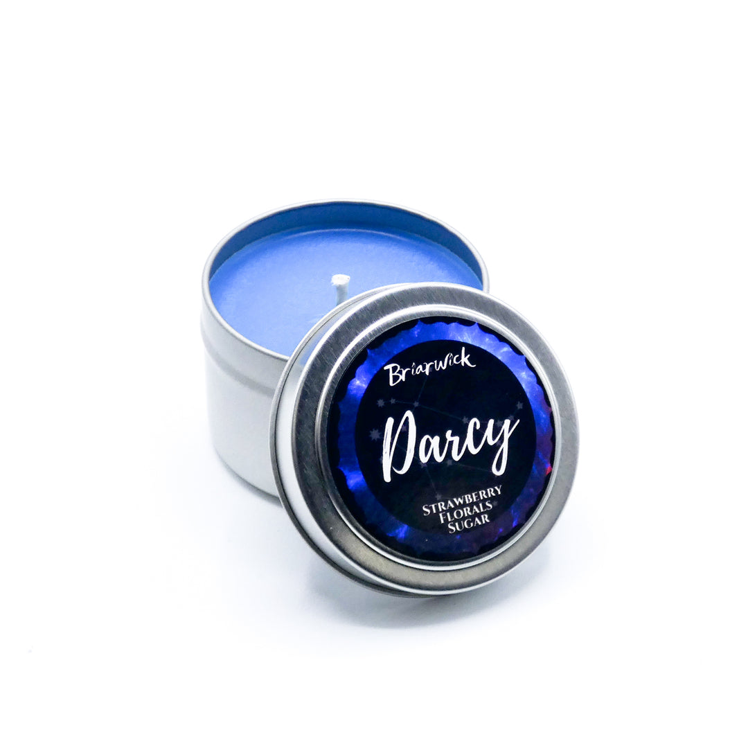 a tin with a blue lid sitting on a white surface