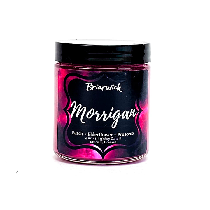 a jar of pink and black powder on a white background