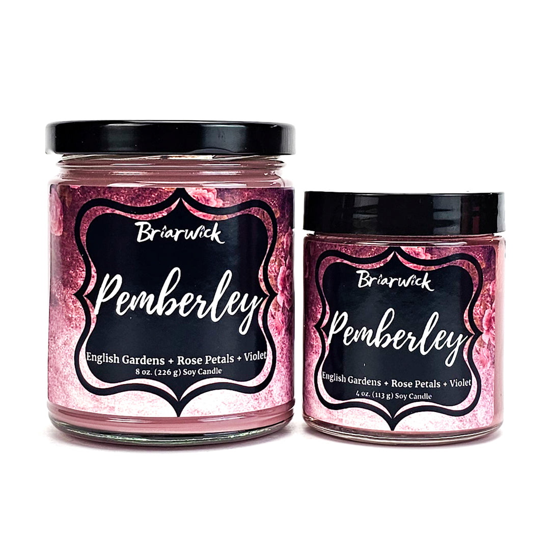 two jars of pink glitter with a black label