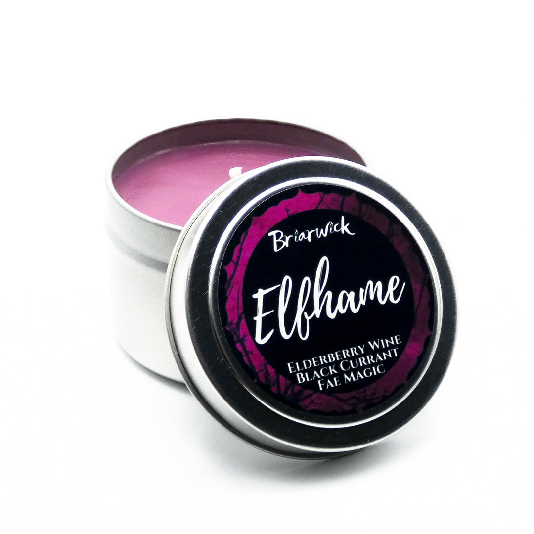 a tin of pink lip bale sitting on top of a white table