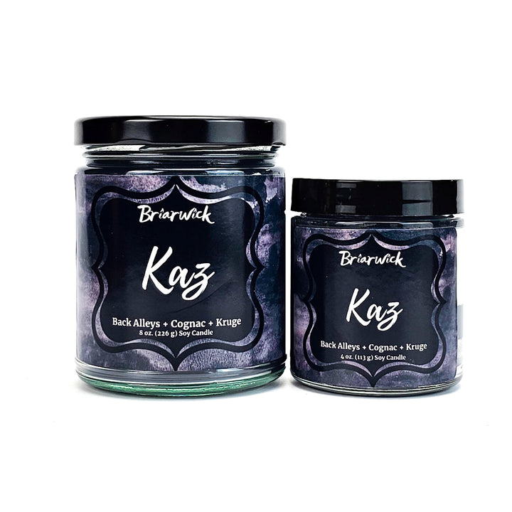two jars of koz candles on a white background