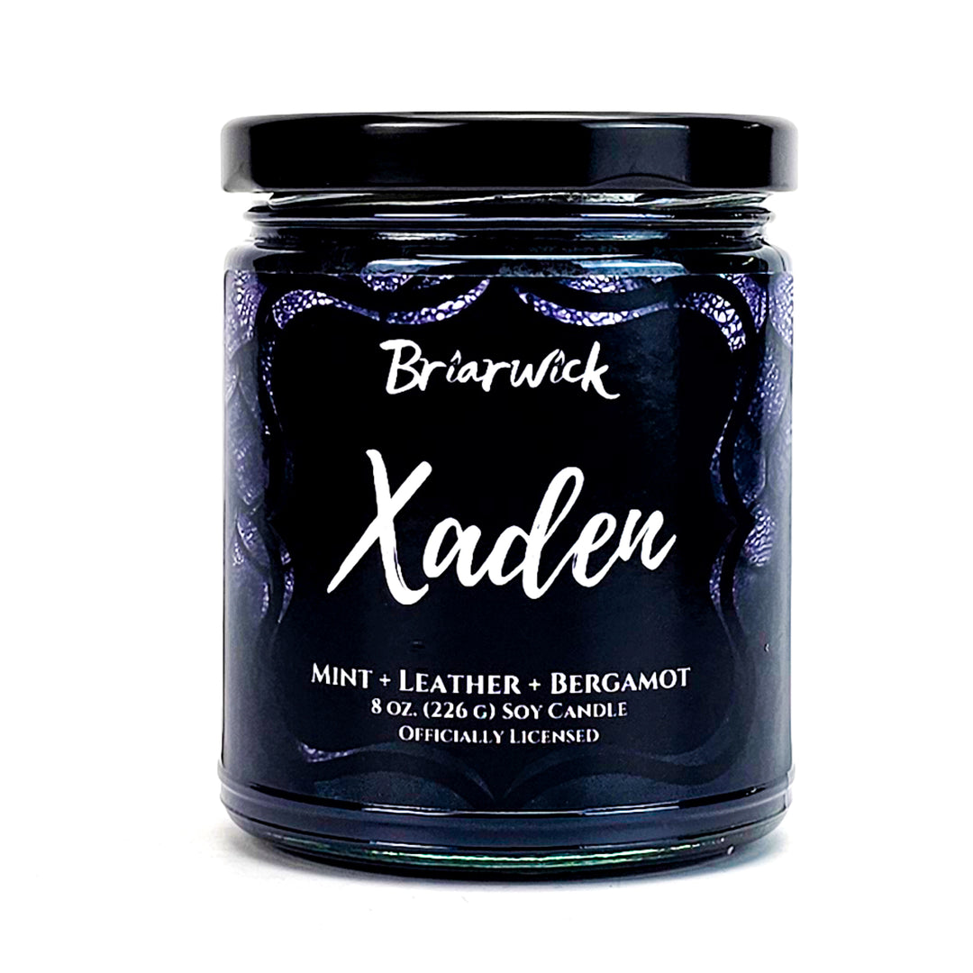 a jar of candle with a black lid