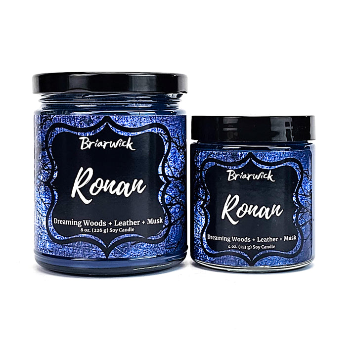 two jars of royal candles sitting next to each other