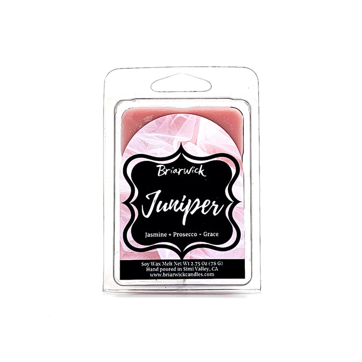 a pink candle in a package on a white background