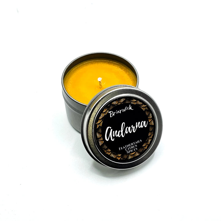a small tin of yellow wax sitting on a white surface