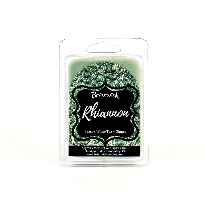 a green candle with a black label on it
