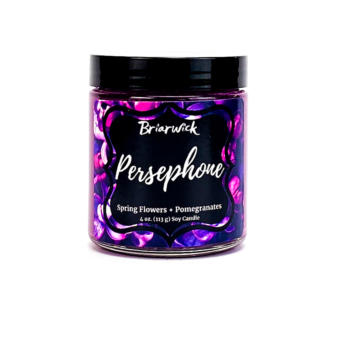 a jar of pink and purple powder on a white background