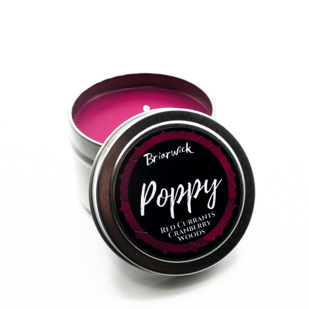 a tin of pink lip butter sitting on top of a white table