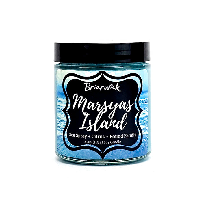a jar of margara island candle on a white background