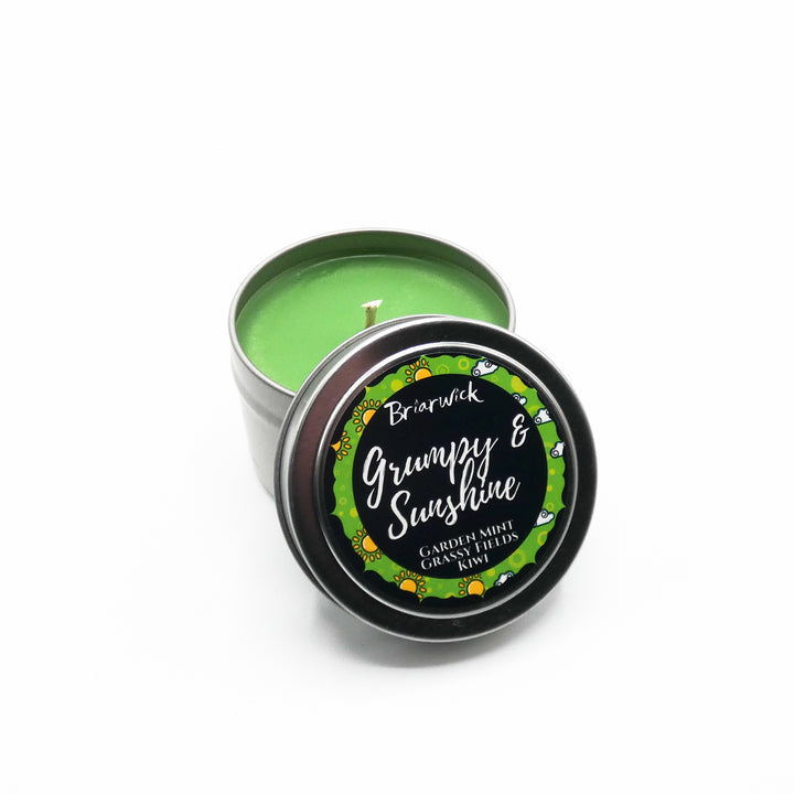 a tin of green and sunshine scented candles