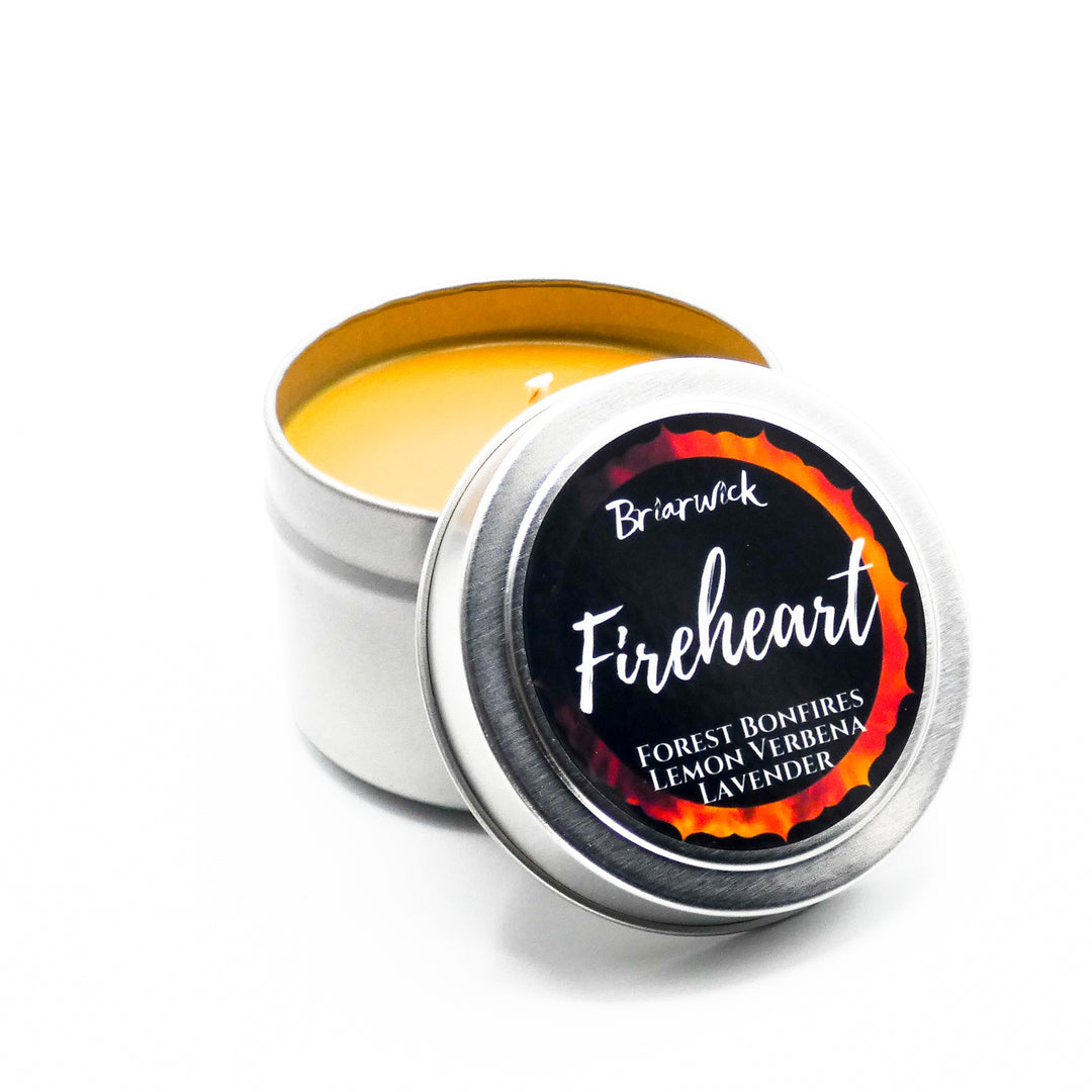 a tin of bright yellow lip bale on a white background