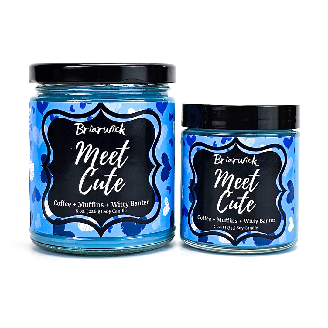 two jars of blue colored food sitting next to each other