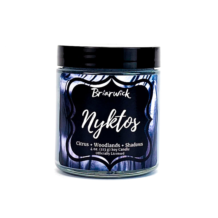 a jar of blue candles with a black label on it