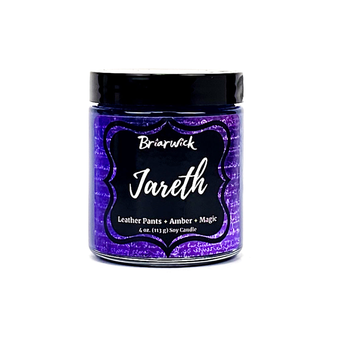 a jar of purple colored paint on a white background