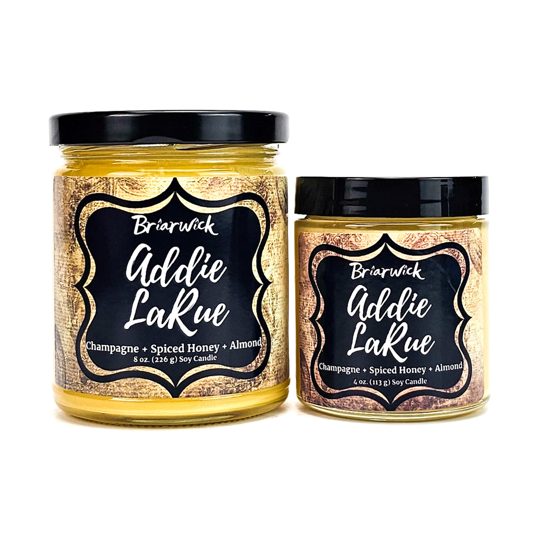 two jars of goldie lake honey on a white background