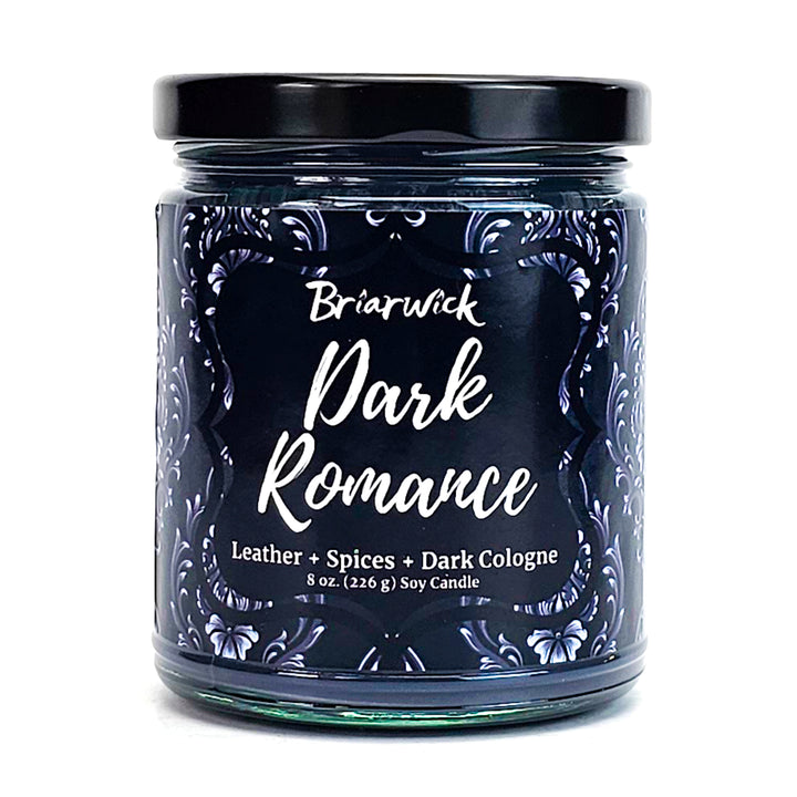 a jar of dark romance candles on a white background