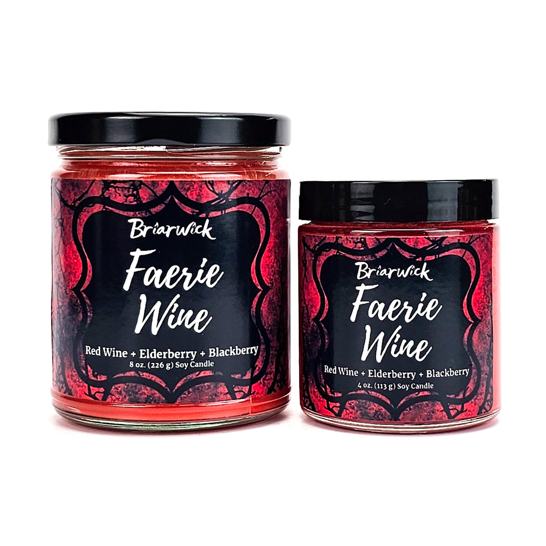 two jars of red wine with black lids