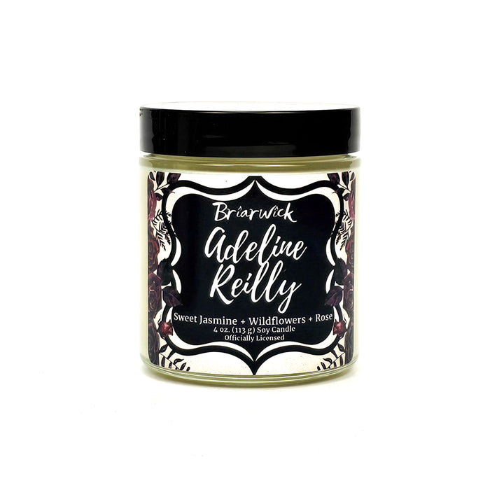 Adeline Reilly 4oz white candle with white floral design on a white background