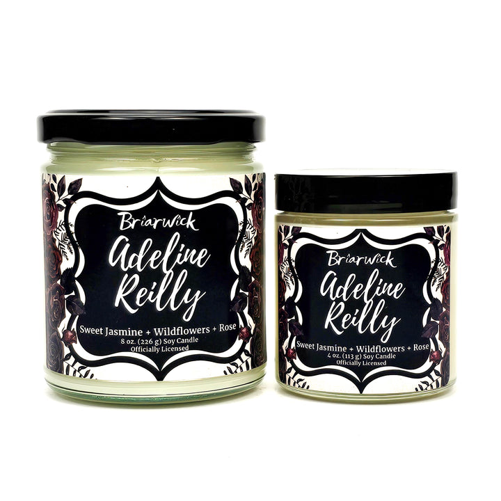 Adeline Reilly 8oz and 4oz white candle with white floral design on a white background