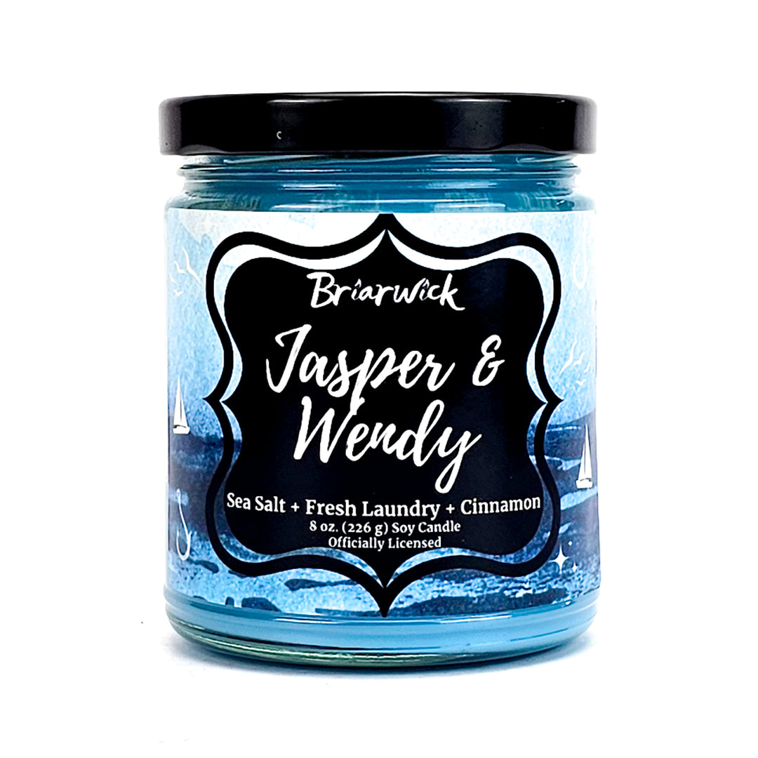 Jasper & Wendy 8oz sky blue candle with blue oceanic design on a white background
