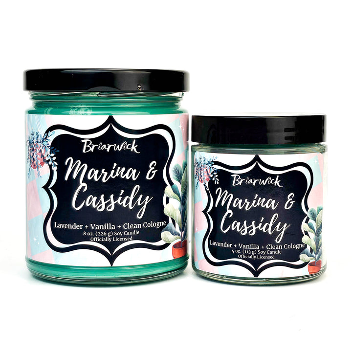 Marina & Cassidy 8oz blue green candle with pink/blue checker design on a white background