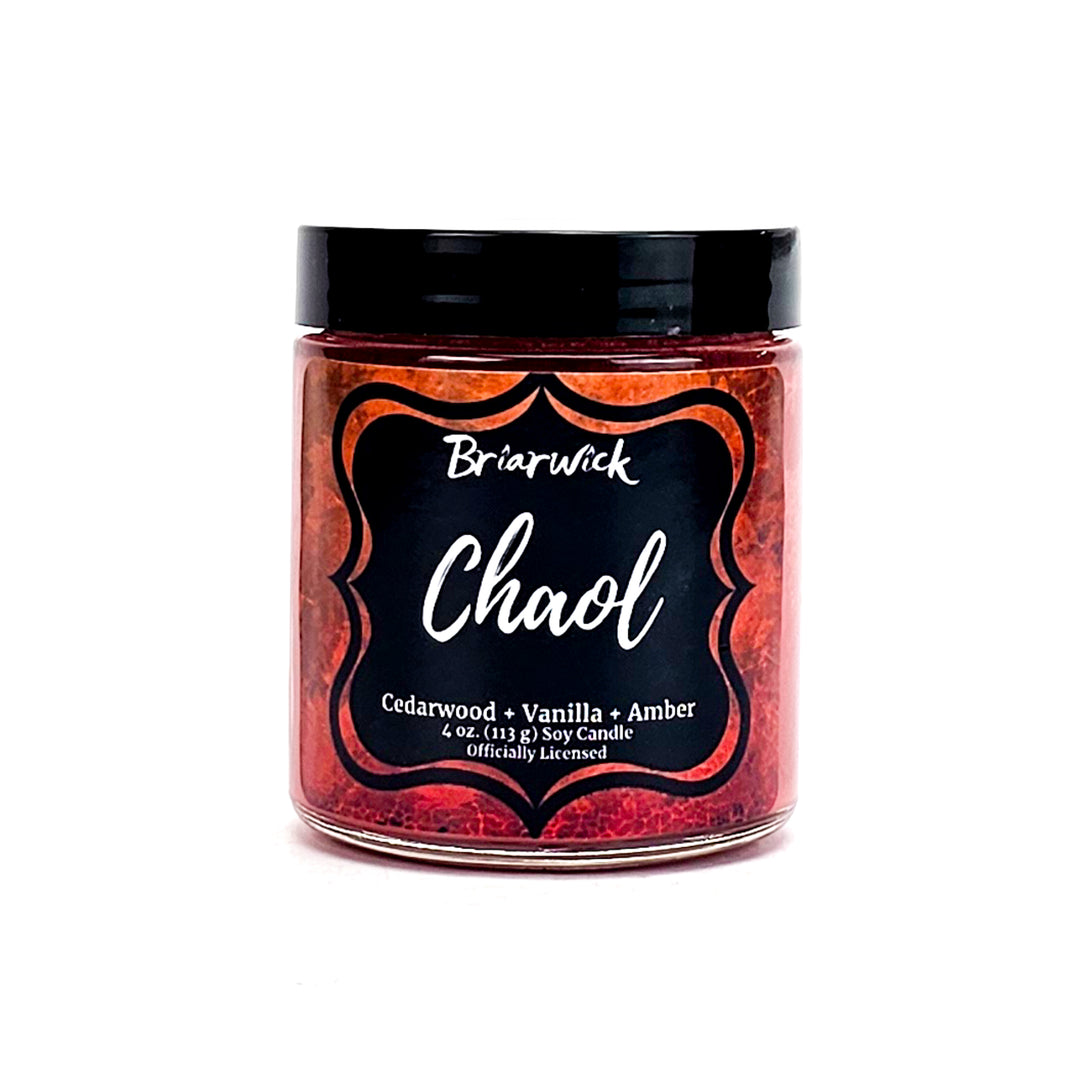 Chaol 4oz burnt orange candle with orange textured design on a white background