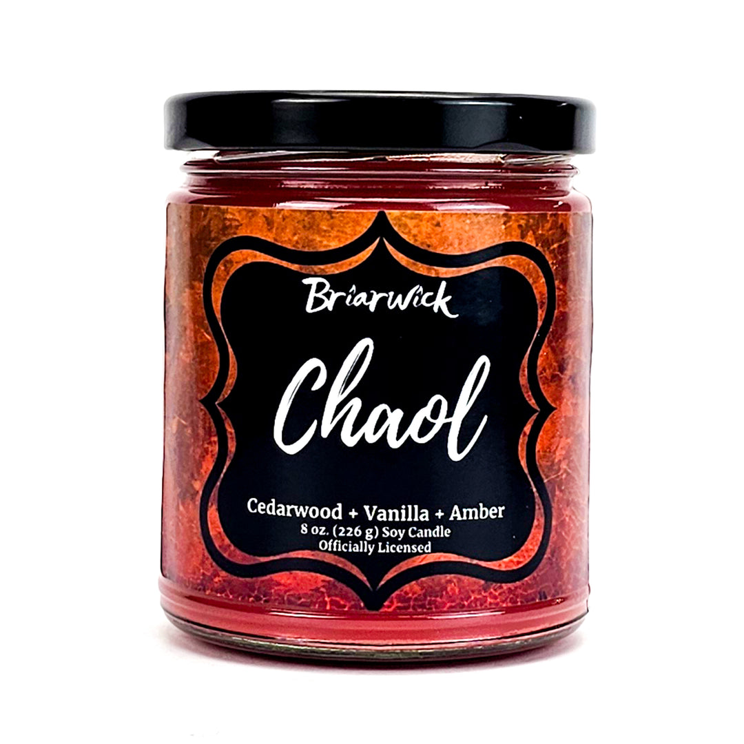 Chaol 8oz burnt orange candle with orange textured design on a white background