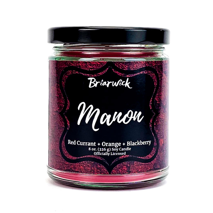 Manon 8oz scarlet candle with red textured design on a white background