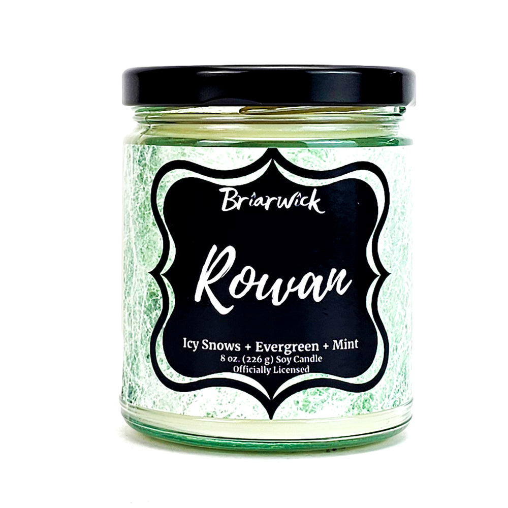 Rowan 8oz white candle with white textured design on a white backgroundn