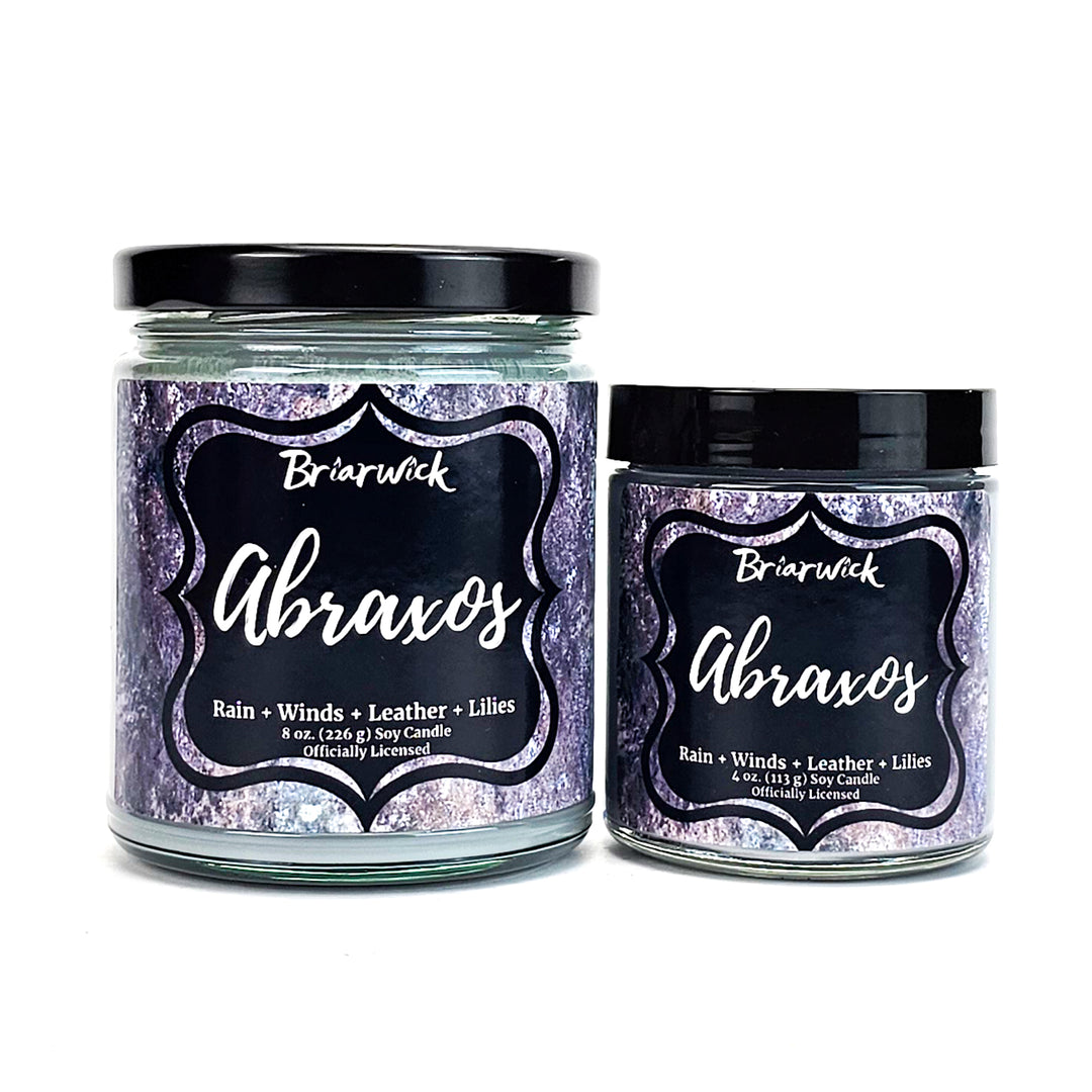Abroaxos 8oz & 4oz flint gray candles with gray textured designs on a white background