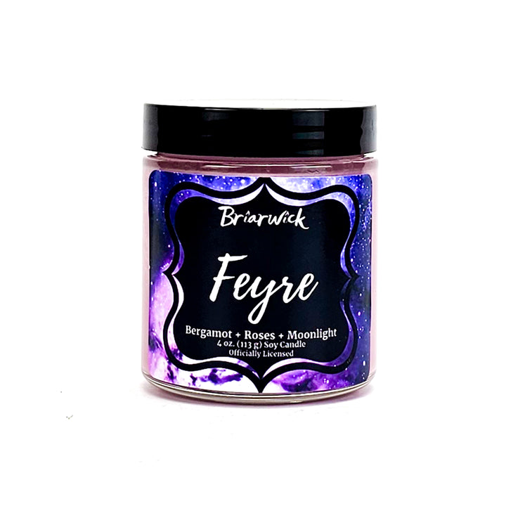 Feyre 4oz powder pink candle with purple galaxy design on a white background