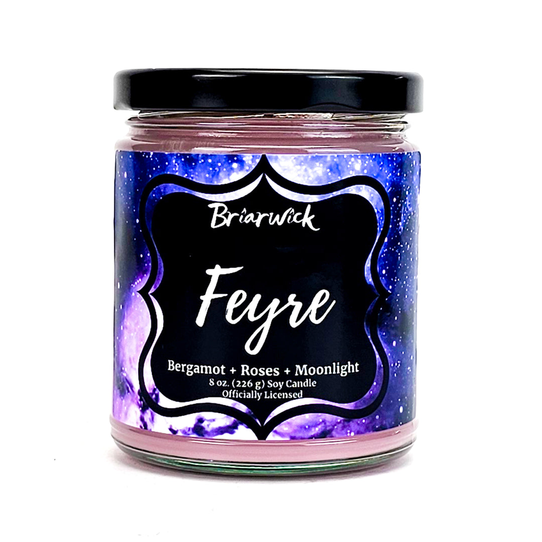 Feyre 8oz powder pink candle with purple galaxy design on a white background