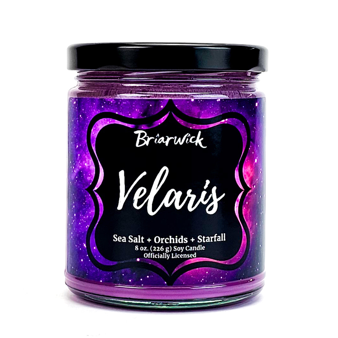 Velaris 8oz violet candle with purple galaxy design on a white background