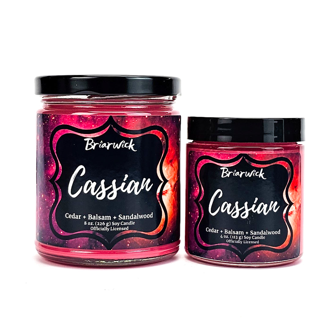 Cassian 8oz & 4oz crimson candles with red galaxy designs on a white background