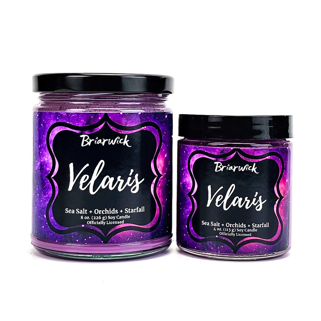Velaris 8oz & 4oz violet candles with purple galaxy designs on a white background