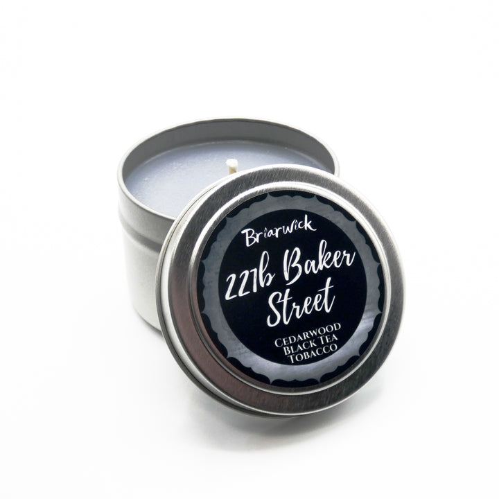 a small tin with a black label on it