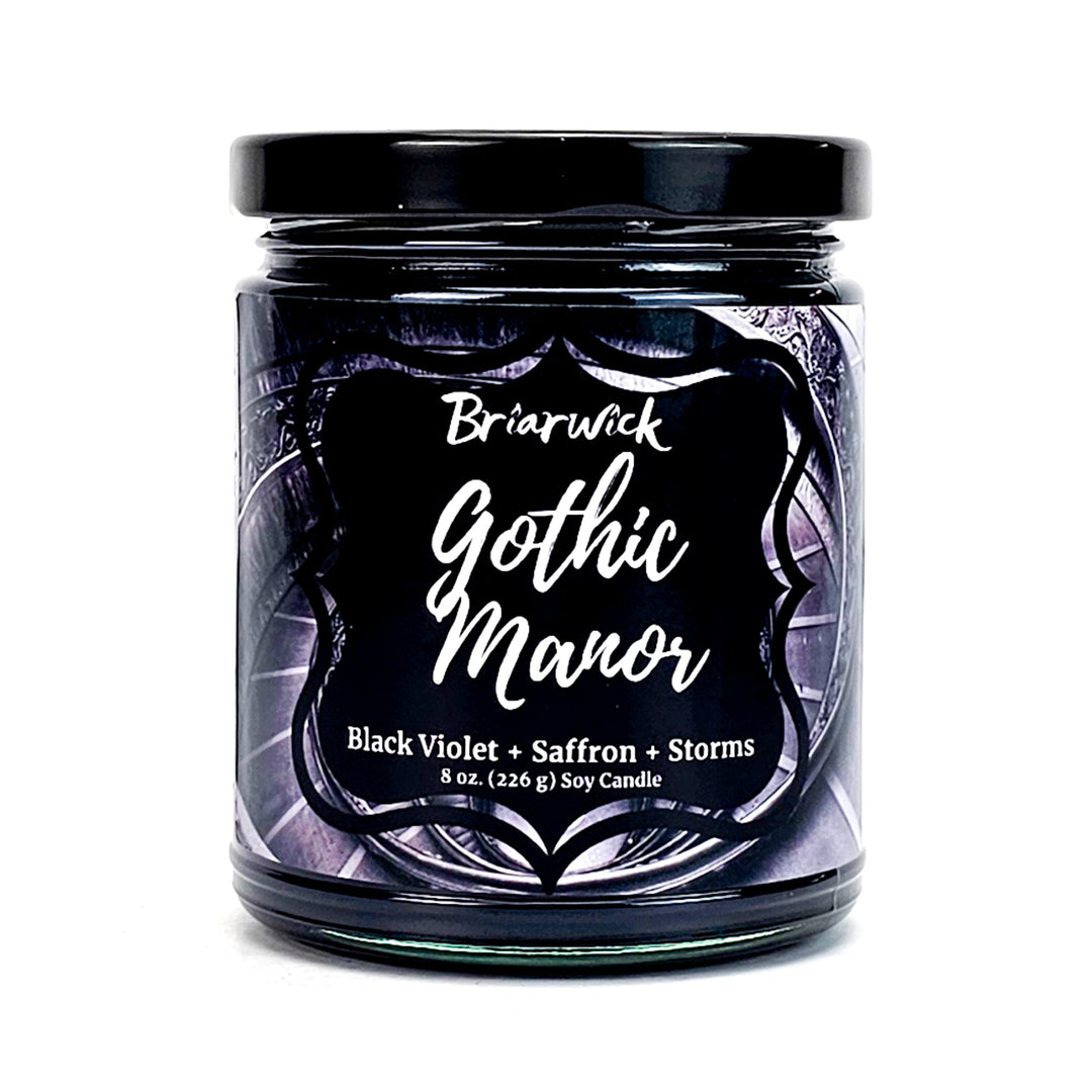 Gothic Manor 8oz charcoal candle with black stairwell design on a white background
