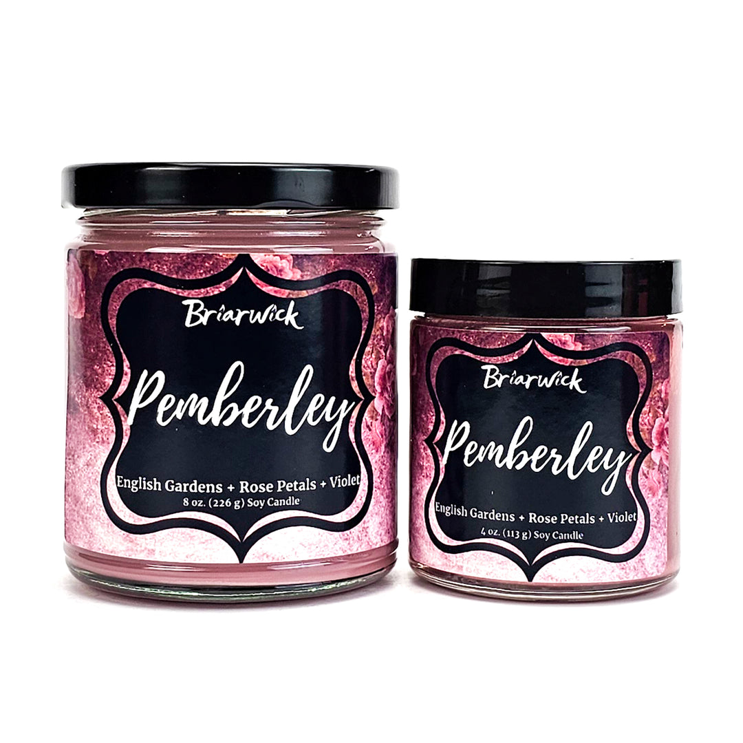 Pemberley 8oz & 4oz pastel pink candles with pink floral designs on a white background