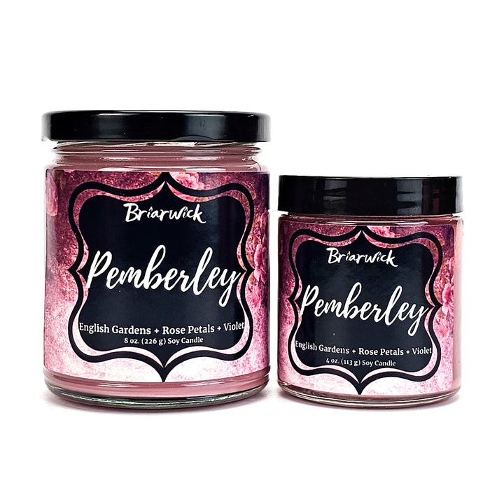 Pemberley 8oz & 4oz pastel pink candles with pink floral designs on a white background