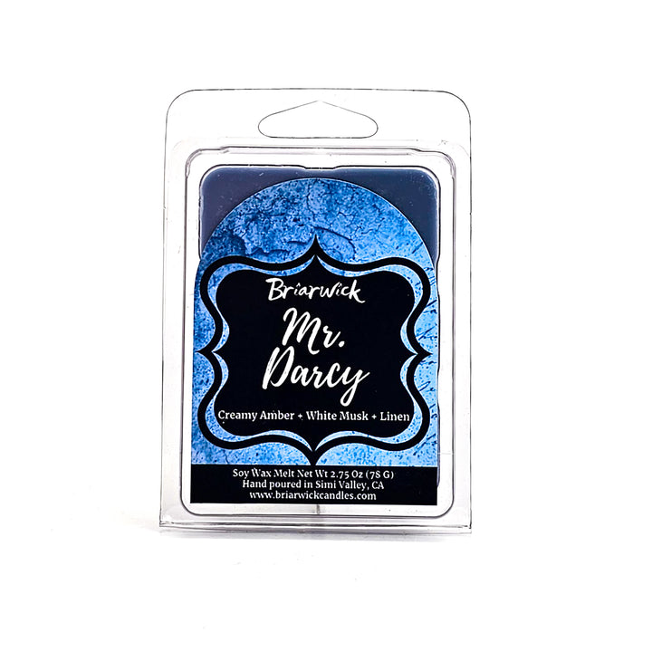 Mr. Darcy 2oz steel blue Wax Melt with blue parchment design on a white background