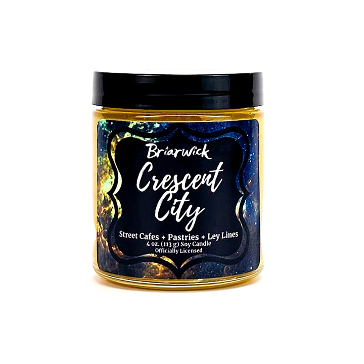 Crescent City 4oz canary yellow candle with yellow galaxy design on a white background