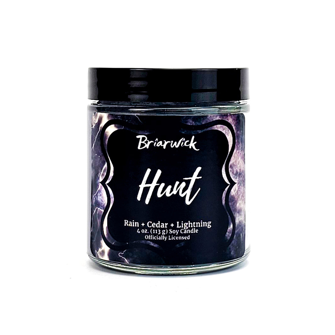 Hunt 4oz silver candle with gray storm design on a white background