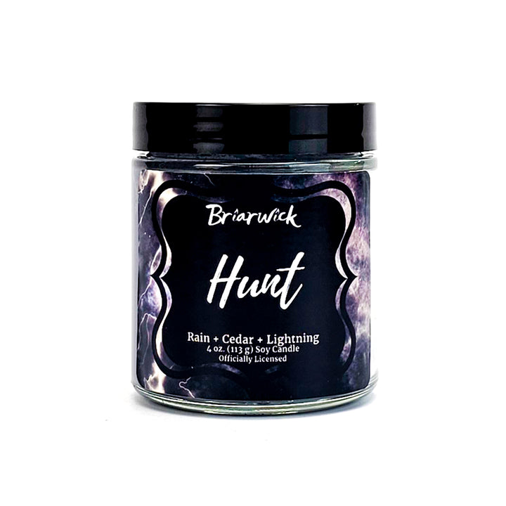 Hunt 4oz silver candle with gray storm design on a white background