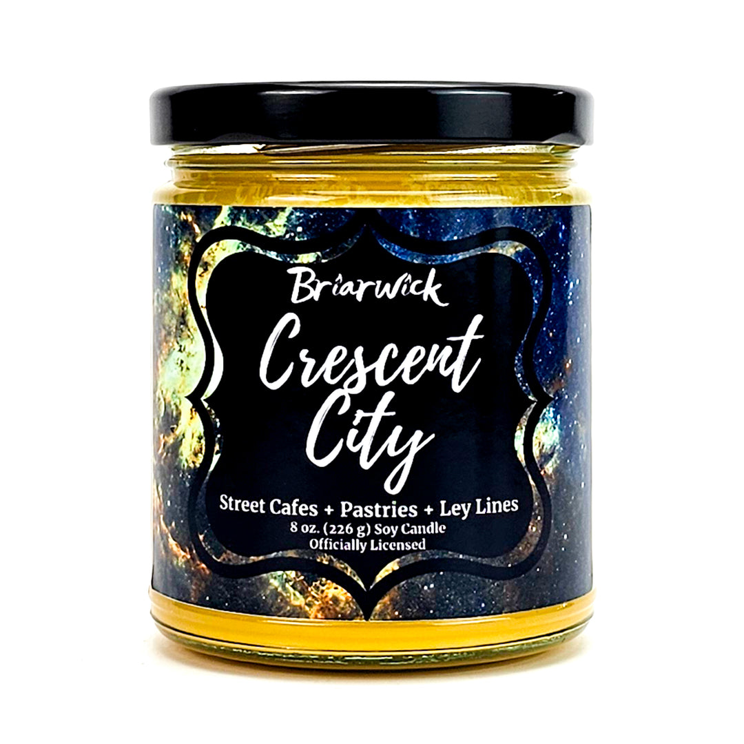 Crescent City 8oz canary yellow candle with yellow galaxy design on a white background