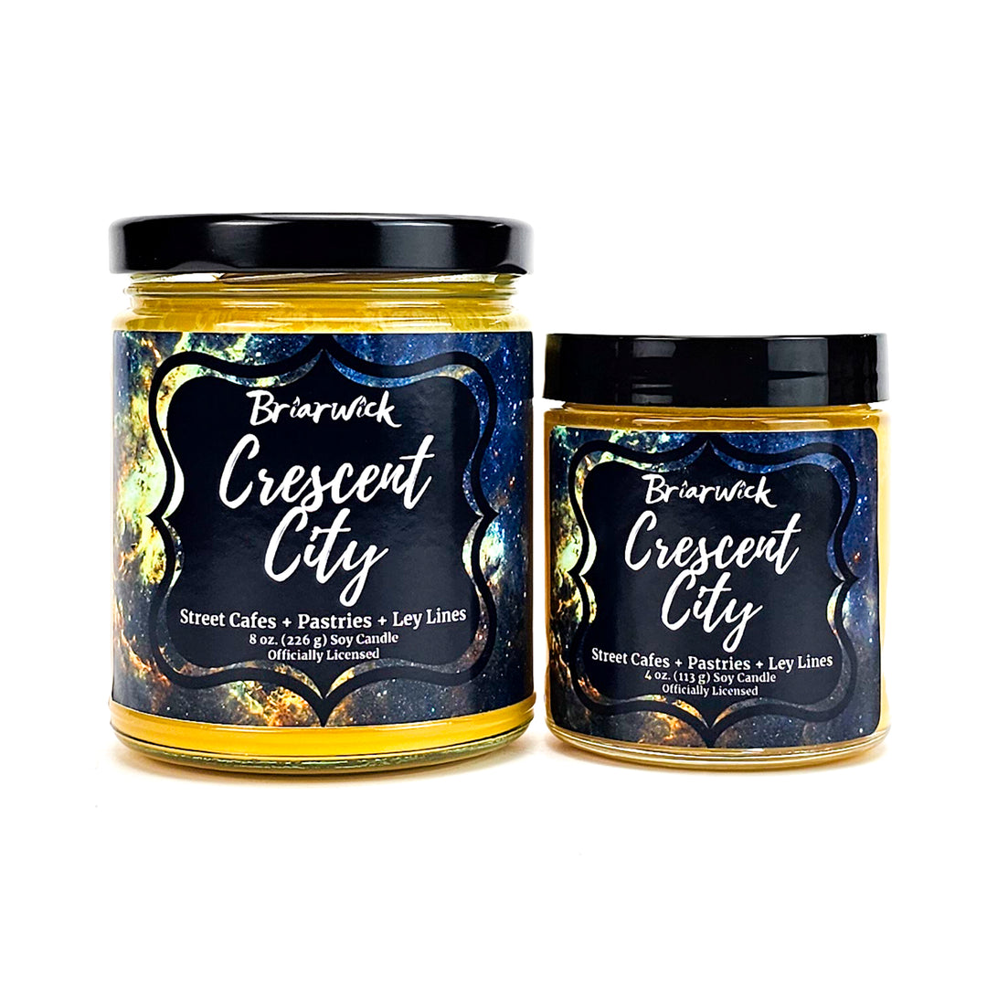 Crescent City 8oz & 4oz canary yellow candles with yellow galaxy designs on a white background
