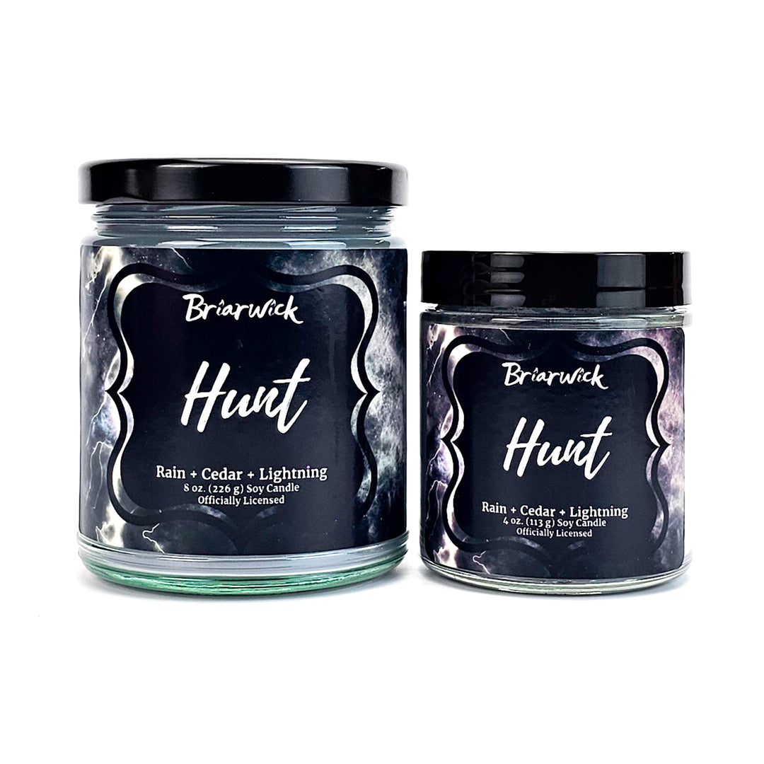 Hunt 8oz & 4oz silver candles with gray storm designs on a white background