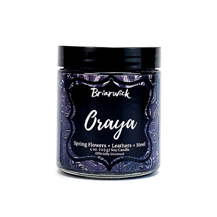 Oraya 4oz charcoal candle with black ornamental design on a white background