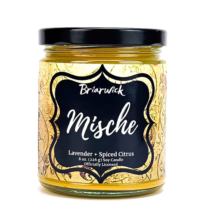 Mische 8oz custard yellow candle with yellow ornamental design on a white background